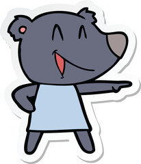 sticker of a cartoon bear in dress laughing and pointing
