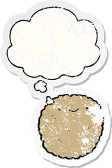 cartoon biscuit and thought bubble as a distressed worn sticker