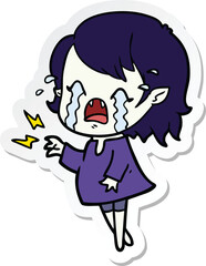sticker of a cartoon crying vampire girl