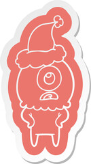 cartoon  sticker of a cyclops alien spaceman wearing santa hat