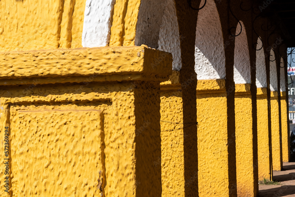 Sticker detail of yellow arches of an old portuguese era building in fontainhas in the city of panjim in goa