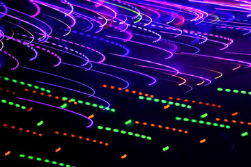 Blurred abstract background. Drawing with light, garlands.