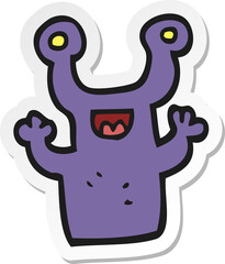 sticker of a cartoon little alien