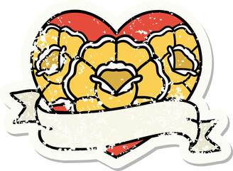 traditional distressed sticker tattoo of a heart and banner with flowers