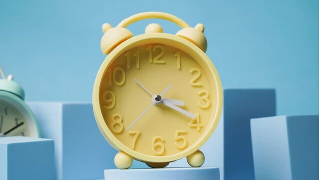 Vintage yellow alarm clock timelapse, daylight savings time clock timelapse, spring time change forward