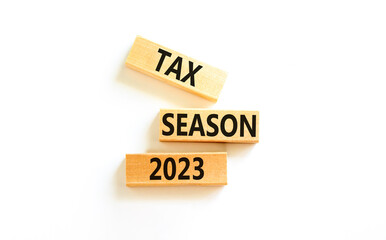 Tax season 2023 symbol. Concept words Tax season 2023 on wooden blocks on a beautiful white table...