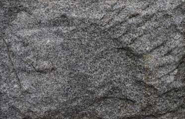 Dark gray granite stone background texture surface.