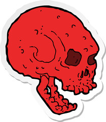 sticker of a cartoon spooky skull