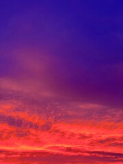 Fototapeta premium Fiery red clouds in the sky at sunset.