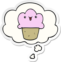 cartoon cupcake with face and thought bubble as a printed sticker