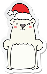 sticker of a cartoon bear wearing christmas hat