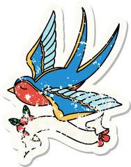 grunge sticker with banner of a swallow