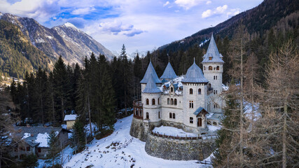 amazing fairytale medieval castle Savoia in Valle d'Aosta in winter . north of Italy. aerial drone view