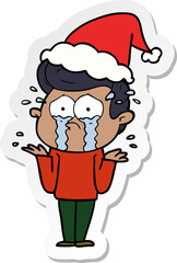 sticker cartoon of a crying man wearing santa hat