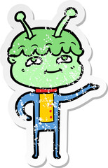 distressed sticker of a friendly cartoon spaceman