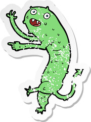 retro distressed sticker of a cartoon gross little monster