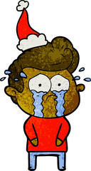 textured cartoon of a crying man wearing santa hat
