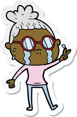 sticker of a cartoon crying woman wearing spectacles