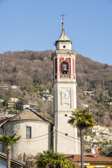 Naklejka premium The bell tower and the parish church of Cannero