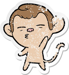 distressed sticker of a cartoon suspicious monkey