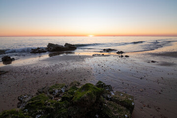 One of the most beautiful beaches in Spain, called (Torre Del Loro, Huelva) in Spain.  Surrounded by dunes, vegetation and cliffs.  A gorgeous beach.