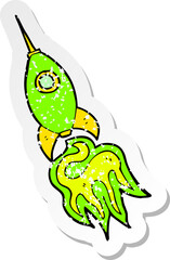 retro distressed sticker of a cartoon space rocket