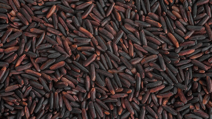 The texture of the surface of the grains of black rice.