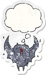 cartoon happy vampire bat and thought bubble as a distressed worn sticker