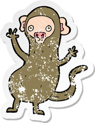 retro distressed sticker of a cartoon monkey