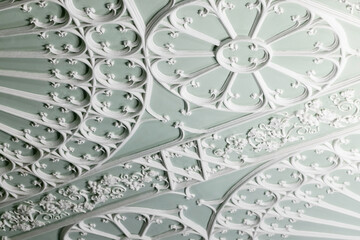 Ceiling design details in Gothic style. White gypsum bas-relief
