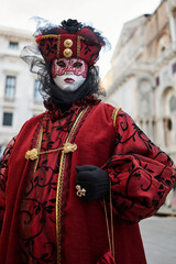 VENICE - FEBRUARY 11: A person in Venetian costume attends the Carnival of Venice, a festival...