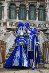 Fototapeta na wymiar VENICE - FEBRUARY 11: A person in Venetian costume attends the Carnival of Venice, a festival starting two weeks before Ash Wednesday in Venice, Italy.