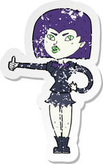retro distressed sticker of a cartoon vampire girl giving thumbs up