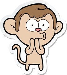 sticker of a cartoon hooting monkey