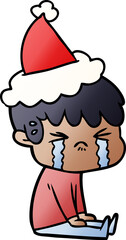 gradient cartoon of a boy crying wearing santa hat