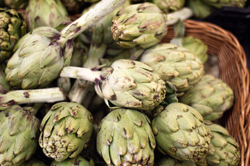 Fototapeta premium Baskets of artichokes for sale in the market