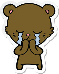 sticker of a crying cartoon bear