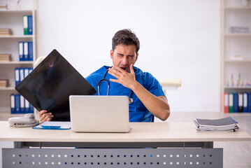 Young male doctor radiologist working in the clinic