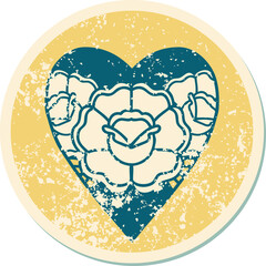 distressed sticker tattoo style icon of a heart and flowers