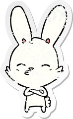 Obraz premium distressed sticker of a curious bunny cartoon