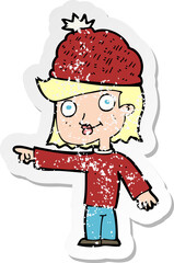 retro distressed sticker of a cartoon woman wearing winter hat