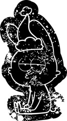 cute cartoon distressed icon of a rabbit wearing santa hat