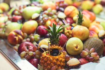 Beautifully decorated banquet catering table with variety of different food snacks, sandwiches, croissants and appetizers on a party event or celebration, delicatessen setting, coffee break