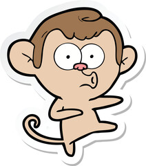 sticker of a cartoon dancing monkey