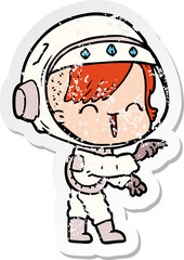 distressed sticker of a cartoon astronaut girl pointing and laughing