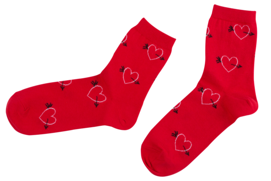 A pair of red socks with a pattern of many hearts, as if walking, on a white background, isolate