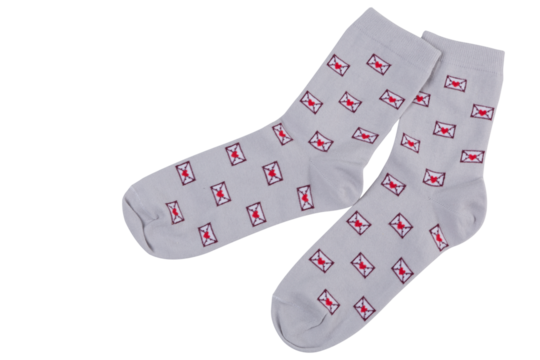 A pair of gray socks with a pattern of many postal envelopes, on a white background, isolate