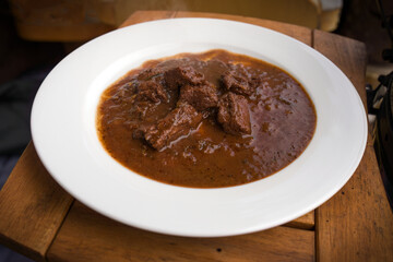 ready to eat - goulash from venison meat served on a white plate