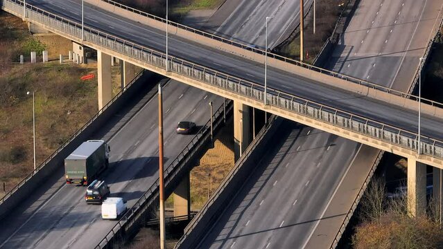 Rush Hour Vehicles Driving on a Motorway Interchange UK Aerial View