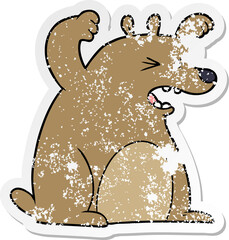 distressed sticker of a cartoon roaring bear